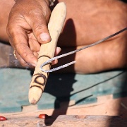 Karke, aborignial making a noise stick.jpg