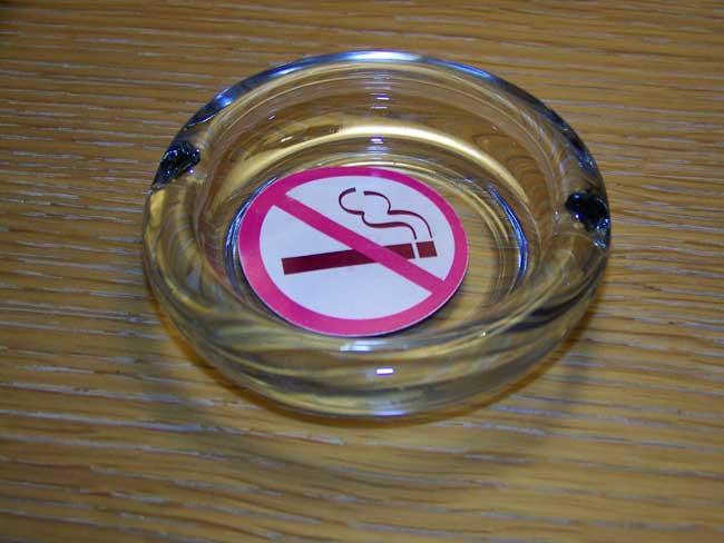 No smoking sign in an ash tray, Paris, France